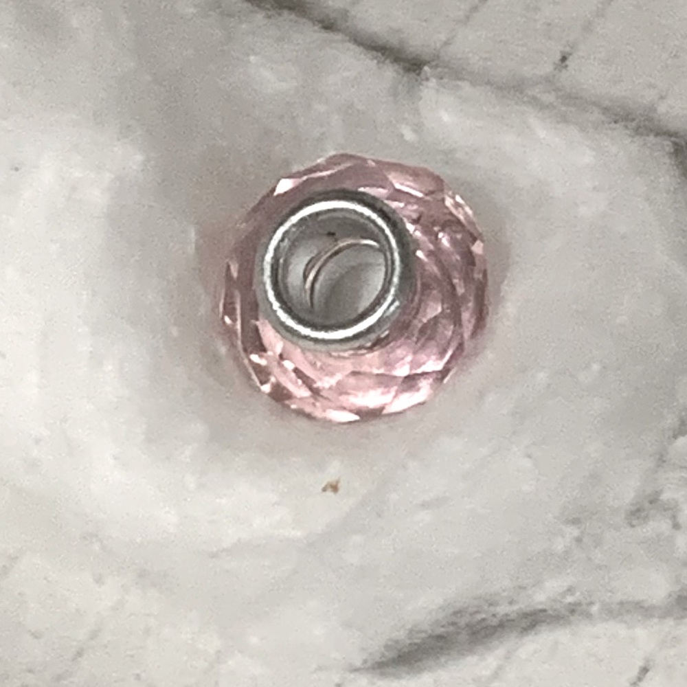 Silver toned pink glass bead